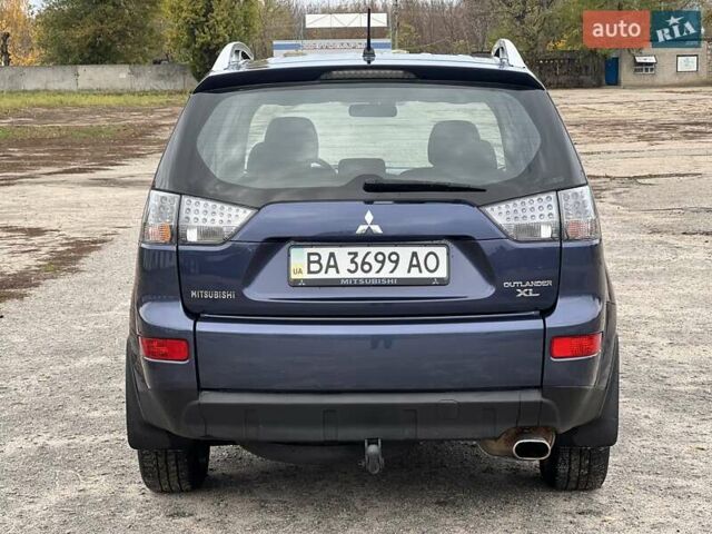 Синий Мицубиси Аутлендер, объемом двигателя 2.4 л и пробегом 94 тыс. км за 8800 $, фото 2 на Automoto.ua