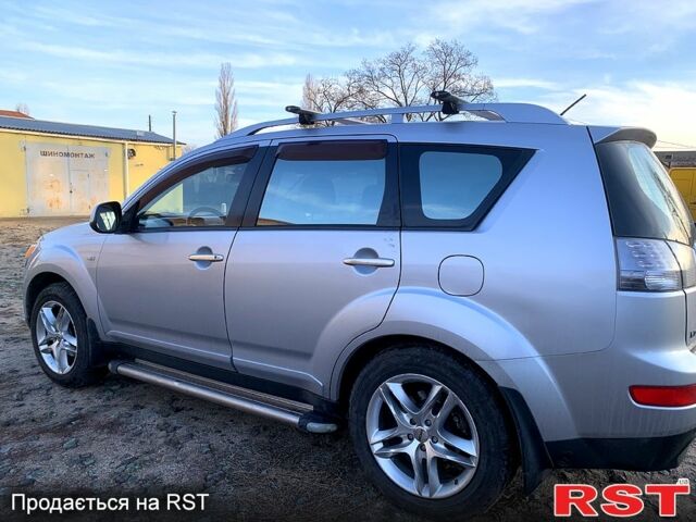 Синий Мицубиси Аутлендер, объемом двигателя 24 л и пробегом 205 тыс. км за 8300 $, фото 8 на Automoto.ua