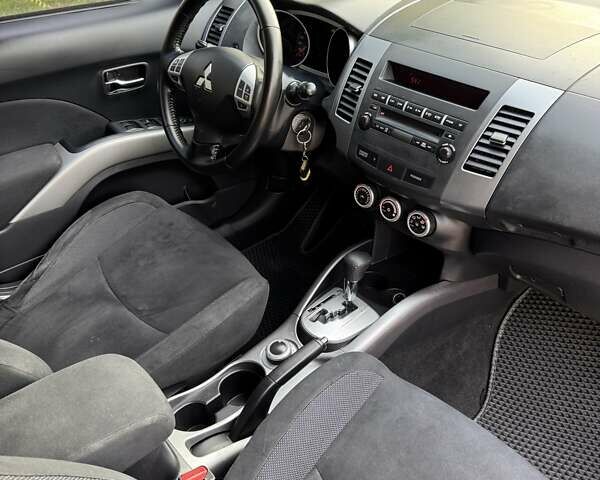 Синий Мицубиси Аутлендер, объемом двигателя 2.36 л и пробегом 223 тыс. км за 8650 $, фото 16 на Automoto.ua