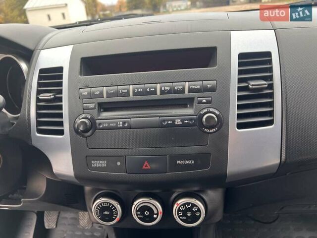 Синий Мицубиси Аутлендер, объемом двигателя 2.4 л и пробегом 94 тыс. км за 8800 $, фото 9 на Automoto.ua