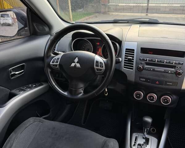 Синий Мицубиси Аутлендер, объемом двигателя 2.36 л и пробегом 223 тыс. км за 8650 $, фото 14 на Automoto.ua