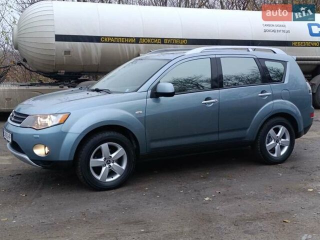 Синий Мицубиси Аутлендер, объемом двигателя 2.4 л и пробегом 264 тыс. км за 7555 $, фото 4 на Automoto.ua