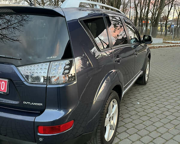 Синий Мицубиси Аутлендер, объемом двигателя 2 л и пробегом 263 тыс. км за 8900 $, фото 6 на Automoto.ua