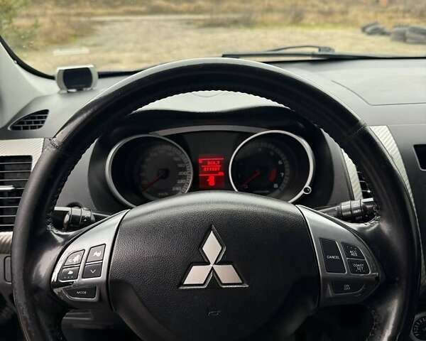 Синий Мицубиси Аутлендер, объемом двигателя 2.4 л и пробегом 211 тыс. км за 7800 $, фото 17 на Automoto.ua