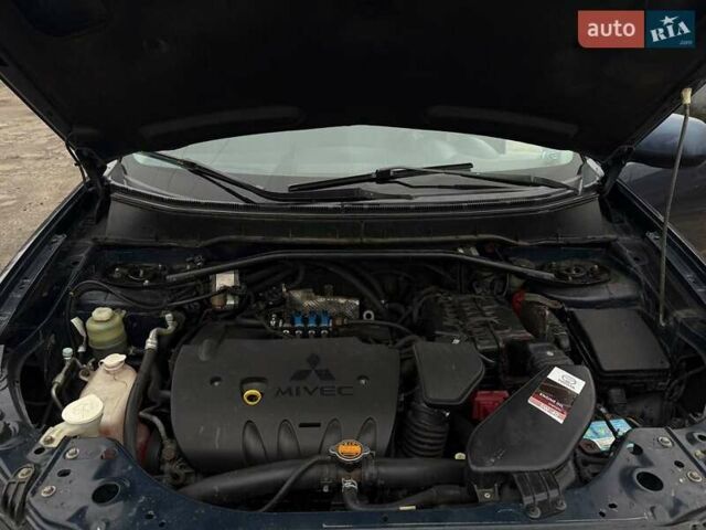 Синий Мицубиси Аутлендер, объемом двигателя 2.4 л и пробегом 211 тыс. км за 7800 $, фото 1 на Automoto.ua