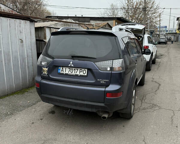 Синий Мицубиси Аутлендер, объемом двигателя 2.36 л и пробегом 269 тыс. км за 7500 $, фото 1 на Automoto.ua