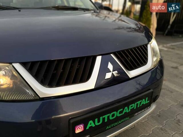 Синій Міцубісі Аутлендер, об'ємом двигуна 2.36 л та пробігом 282 тис. км за 9490 $, фото 6 на Automoto.ua