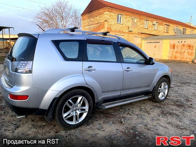 Синий Мицубиси Аутлендер, объемом двигателя 24 л и пробегом 205 тыс. км за 8300 $, фото 7 на Automoto.ua