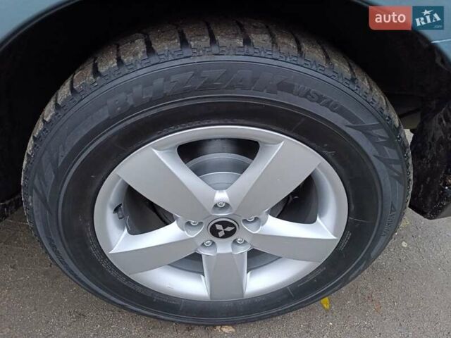 Синий Мицубиси Аутлендер, объемом двигателя 2.4 л и пробегом 264 тыс. км за 7555 $, фото 44 на Automoto.ua