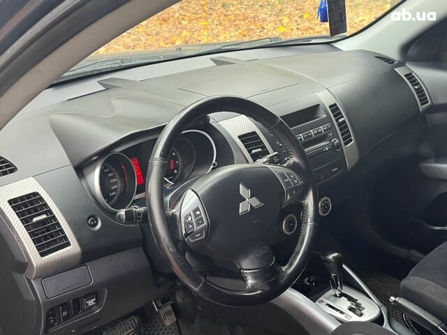 Синій Міцубісі Аутлендер, об'ємом двигуна 2.4 л та пробігом 211 тис. км за 8390 $, фото 28 на Automoto.ua