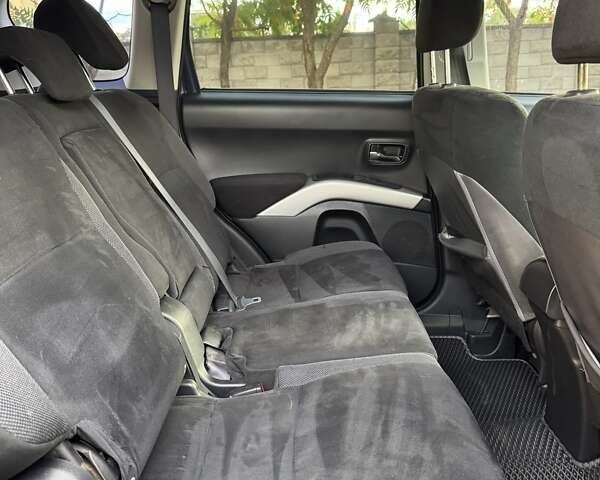 Синий Мицубиси Аутлендер, объемом двигателя 2.36 л и пробегом 223 тыс. км за 8650 $, фото 13 на Automoto.ua