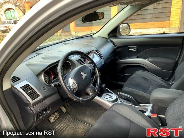 Синий Мицубиси Аутлендер, объемом двигателя 24 л и пробегом 205 тыс. км за 8300 $, фото 6 на Automoto.ua