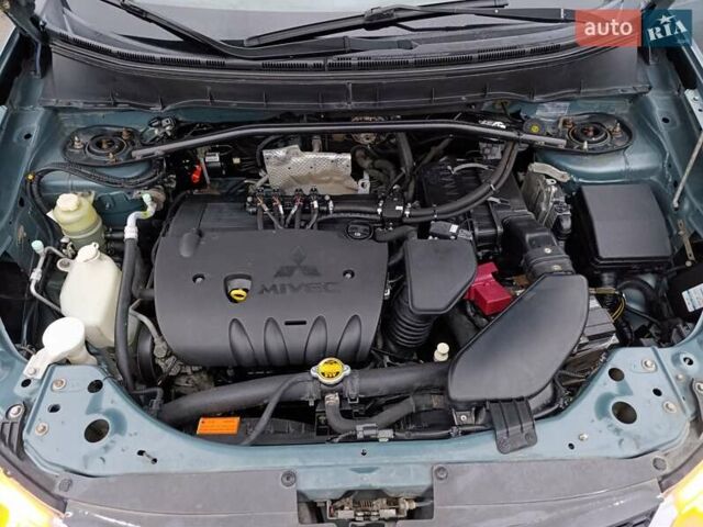 Синий Мицубиси Аутлендер, объемом двигателя 2.4 л и пробегом 264 тыс. км за 7555 $, фото 43 на Automoto.ua