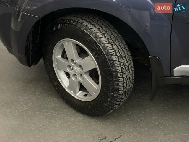 Синій Міцубісі Аутлендер, об'ємом двигуна 2.4 л та пробігом 126 тис. км за 10438 $, фото 7 на Automoto.ua