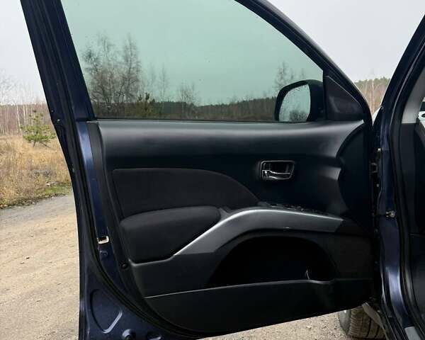 Синий Мицубиси Аутлендер, объемом двигателя 2.4 л и пробегом 211 тыс. км за 7800 $, фото 23 на Automoto.ua