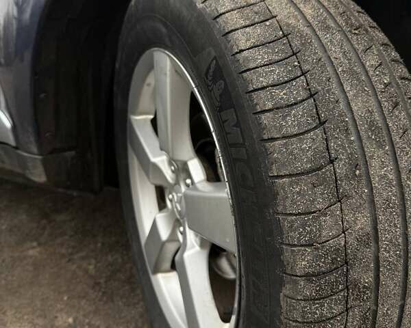 Синий Мицубиси Аутлендер, объемом двигателя 2.4 л и пробегом 211 тыс. км за 7800 $, фото 2 на Automoto.ua