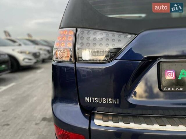 Синій Міцубісі Аутлендер, об'ємом двигуна 2.36 л та пробігом 282 тис. км за 9490 $, фото 14 на Automoto.ua