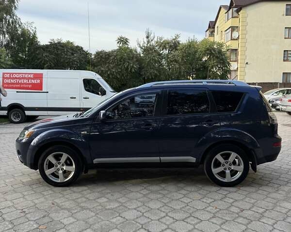 Синий Мицубиси Аутлендер, объемом двигателя 2.36 л и пробегом 223 тыс. км за 8650 $, фото 7 на Automoto.ua