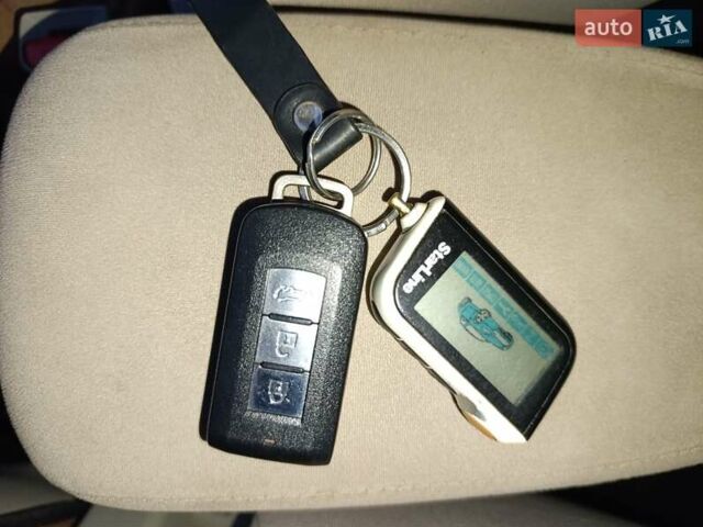 Синий Мицубиси Аутлендер, объемом двигателя 2.4 л и пробегом 264 тыс. км за 7555 $, фото 45 на Automoto.ua