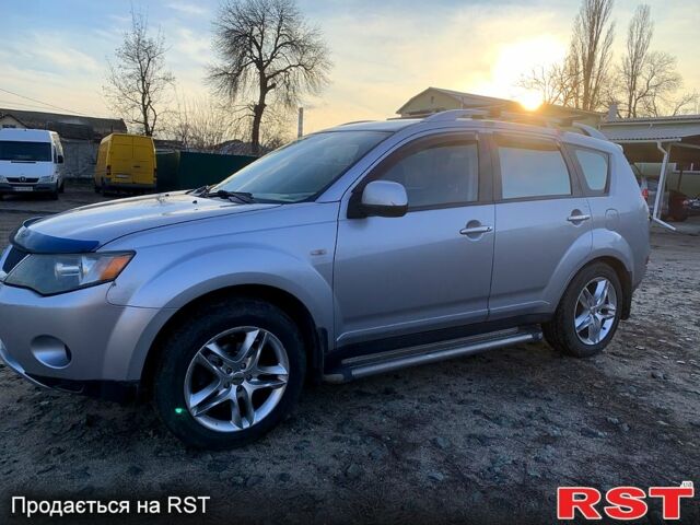 Синий Мицубиси Аутлендер, объемом двигателя 24 л и пробегом 205 тыс. км за 8300 $, фото 9 на Automoto.ua