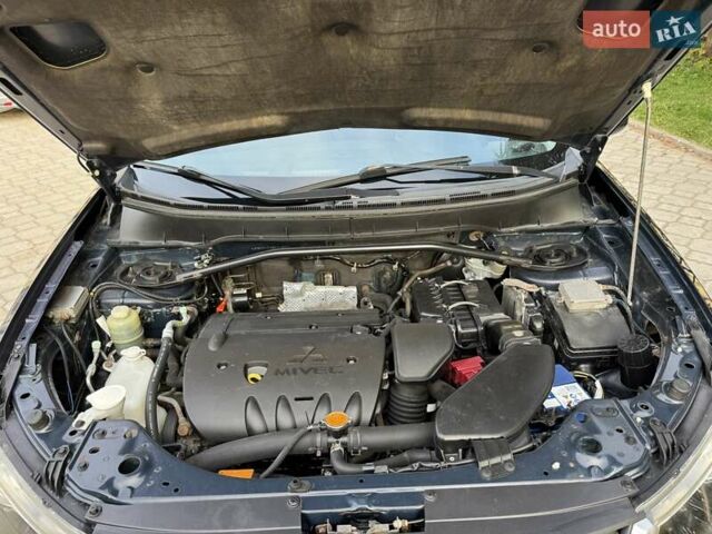 Синий Мицубиси Аутлендер, объемом двигателя 2.36 л и пробегом 223 тыс. км за 8650 $, фото 21 на Automoto.ua