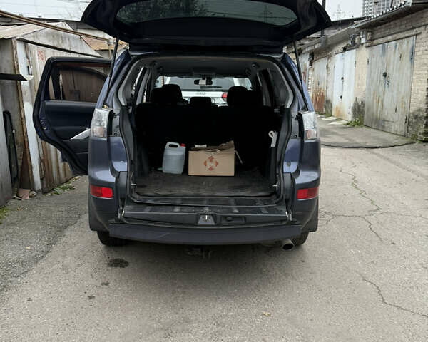 Синий Мицубиси Аутлендер, объемом двигателя 2.36 л и пробегом 269 тыс. км за 7500 $, фото 8 на Automoto.ua