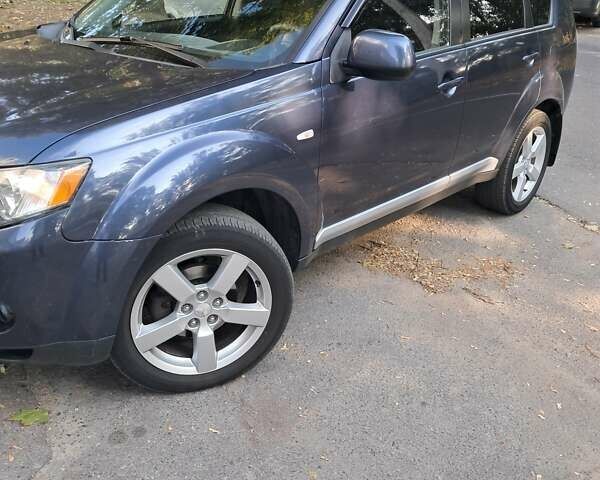 Синий Мицубиси Аутлендер, объемом двигателя 2.4 л и пробегом 160 тыс. км за 8800 $, фото 5 на Automoto.ua