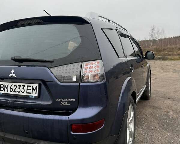 Синий Мицубиси Аутлендер, объемом двигателя 2.4 л и пробегом 211 тыс. км за 7800 $, фото 6 на Automoto.ua