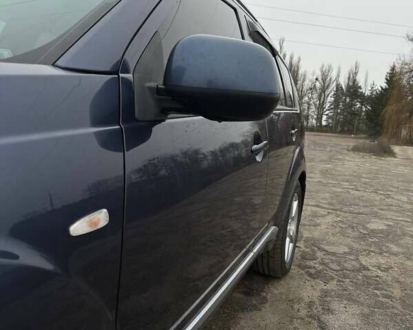 Синий Мицубиси Аутлендер, объемом двигателя 2.4 л и пробегом 211 тыс. км за 7800 $, фото 5 на Automoto.ua