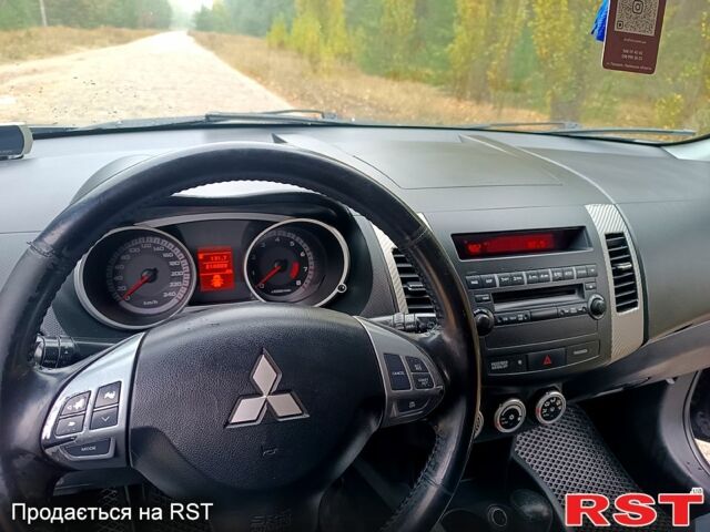 Синій Міцубісі Аутлендер, об'ємом двигуна 2.4 л та пробігом 210 тис. км за 8100 $, фото 1 на Automoto.ua