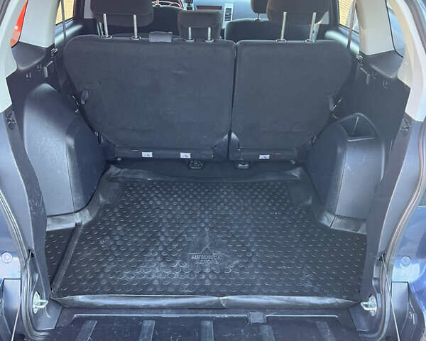 Синий Мицубиси Аутлендер, объемом двигателя 2 л и пробегом 263 тыс. км за 8900 $, фото 38 на Automoto.ua