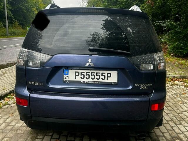 Синий Мицубиси Аутлендер, объемом двигателя 2.4 л и пробегом 284 тыс. км за 9250 $, фото 4 на Automoto.ua