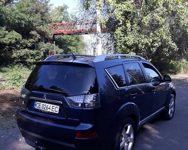 Синий Мицубиси Аутлендер, объемом двигателя 2.18 л и пробегом 205 тыс. км за 11000 $, фото 1 на Automoto.ua