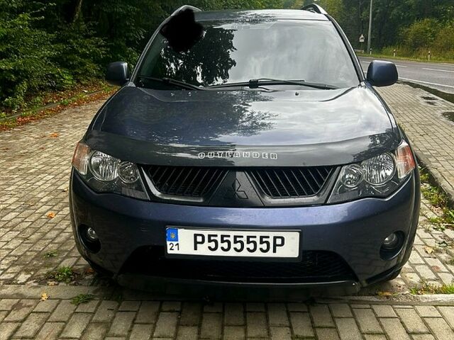 Синий Мицубиси Аутлендер, объемом двигателя 2.4 л и пробегом 284 тыс. км за 9250 $, фото 2 на Automoto.ua