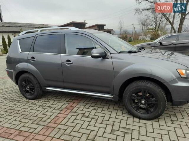 Синий Мицубиси Аутлендер, объемом двигателя 2 л и пробегом 200 тыс. км за 10500 $, фото 13 на Automoto.ua