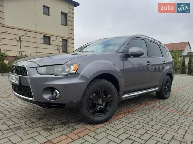 Синий Мицубиси Аутлендер, объемом двигателя 2 л и пробегом 200 тыс. км за 10500 $, фото 3 на Automoto.ua