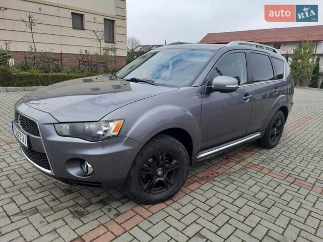 Синий Мицубиси Аутлендер, объемом двигателя 2 л и пробегом 200 тыс. км за 10500 $, фото 6 на Automoto.ua