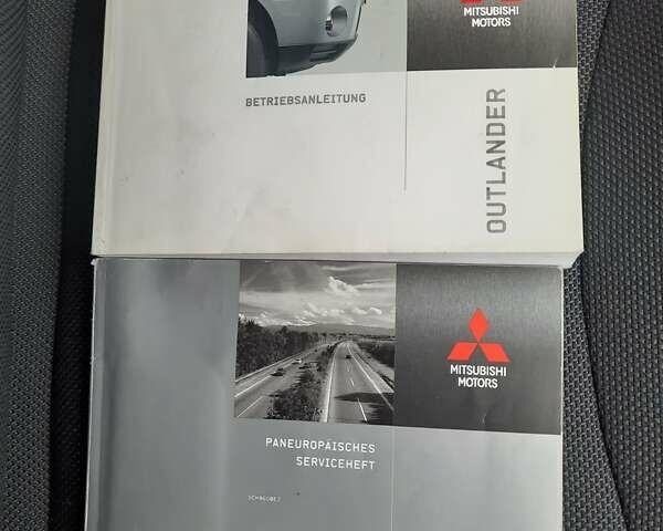 Синий Мицубиси Аутлендер, объемом двигателя 2 л и пробегом 200 тыс. км за 10500 $, фото 27 на Automoto.ua
