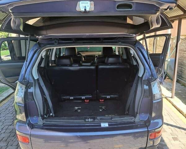 Синий Мицубиси Аутлендер, объемом двигателя 2.18 л и пробегом 205 тыс. км за 11000 $, фото 7 на Automoto.ua