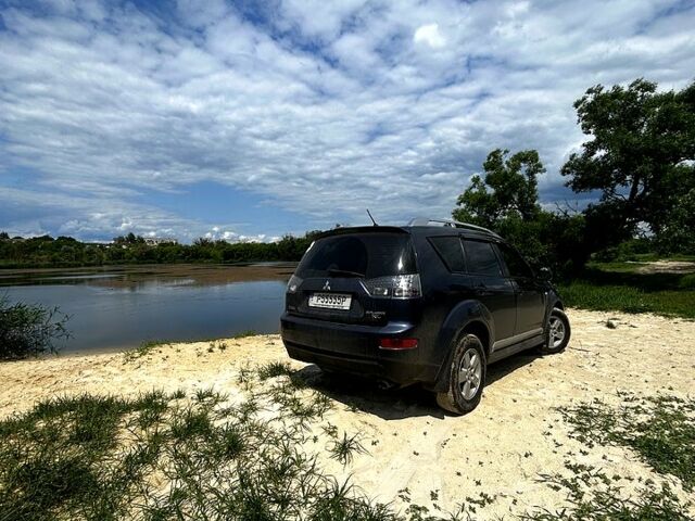 Синий Мицубиси Аутлендер, объемом двигателя 2.4 л и пробегом 284 тыс. км за 9250 $, фото 5 на Automoto.ua