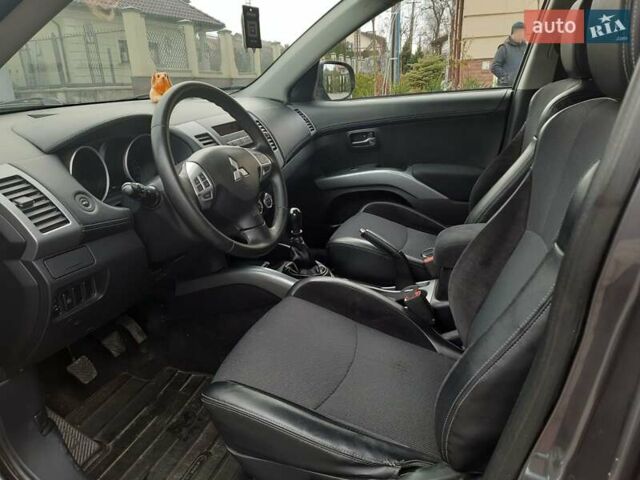 Синий Мицубиси Аутлендер, объемом двигателя 2 л и пробегом 200 тыс. км за 10500 $, фото 21 на Automoto.ua