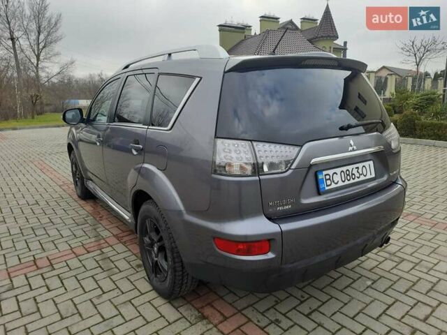 Синий Мицубиси Аутлендер, объемом двигателя 2 л и пробегом 200 тыс. км за 10500 $, фото 9 на Automoto.ua
