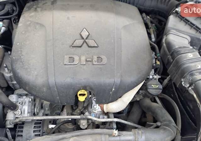 Синий Мицубиси Аутлендер, объемом двигателя 2.18 л и пробегом 205 тыс. км за 11000 $, фото 3 на Automoto.ua