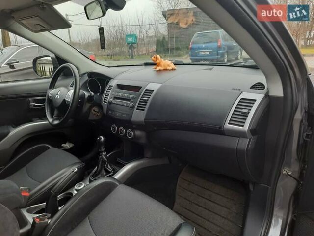 Синий Мицубиси Аутлендер, объемом двигателя 2 л и пробегом 200 тыс. км за 10500 $, фото 26 на Automoto.ua