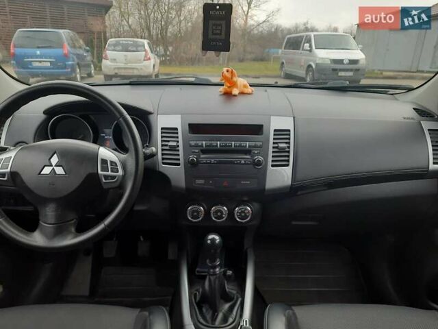 Синий Мицубиси Аутлендер, объемом двигателя 2 л и пробегом 200 тыс. км за 10500 $, фото 23 на Automoto.ua