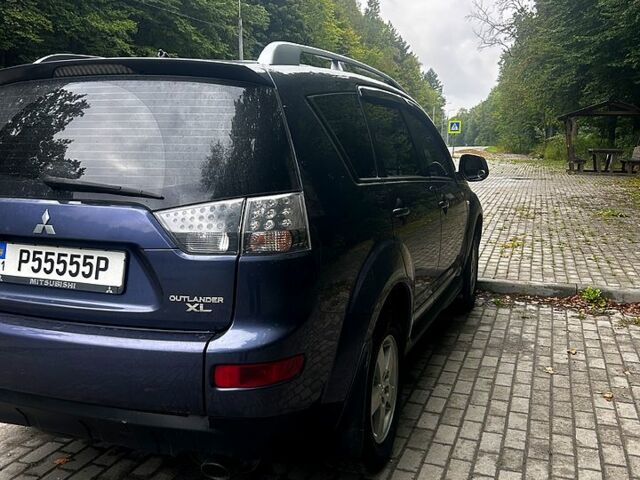 Синий Мицубиси Аутлендер, объемом двигателя 2.4 л и пробегом 284 тыс. км за 9250 $, фото 3 на Automoto.ua