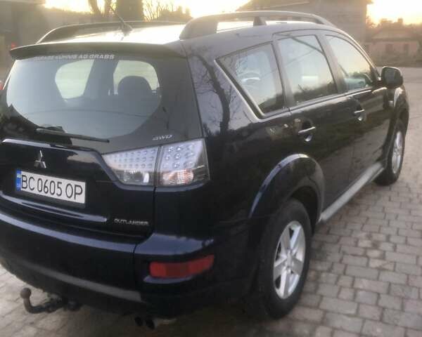 Синий Мицубиси Аутлендер, объемом двигателя 2 л и пробегом 235 тыс. км за 8800 $, фото 1 на Automoto.ua