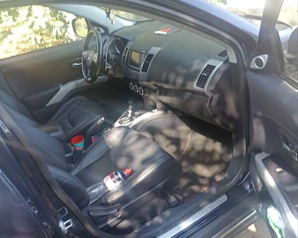 Синий Мицубиси Аутлендер, объемом двигателя 2.18 л и пробегом 223 тыс. км за 11200 $, фото 11 на Automoto.ua