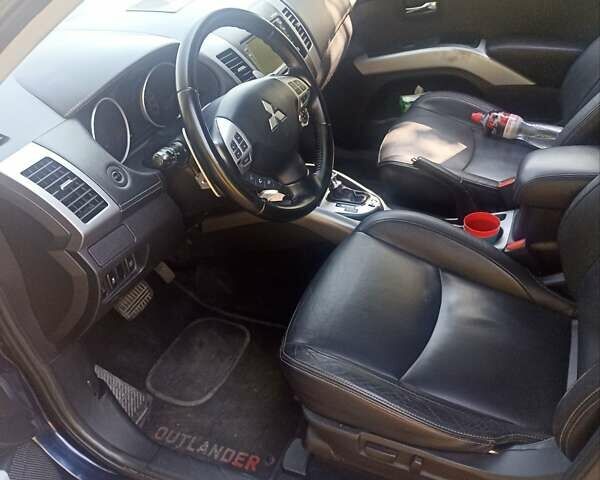 Синий Мицубиси Аутлендер, объемом двигателя 2.18 л и пробегом 223 тыс. км за 11200 $, фото 7 на Automoto.ua