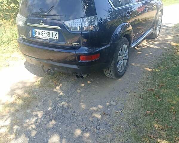 Синий Мицубиси Аутлендер, объемом двигателя 2.18 л и пробегом 223 тыс. км за 11200 $, фото 1 на Automoto.ua